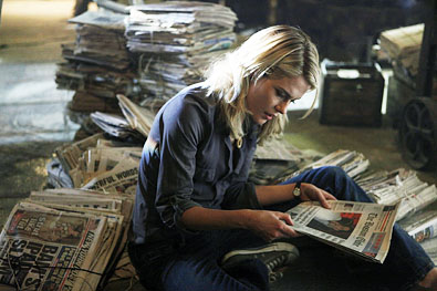 Jane looking through old newspapers