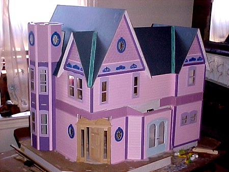 A large pink dollhouse